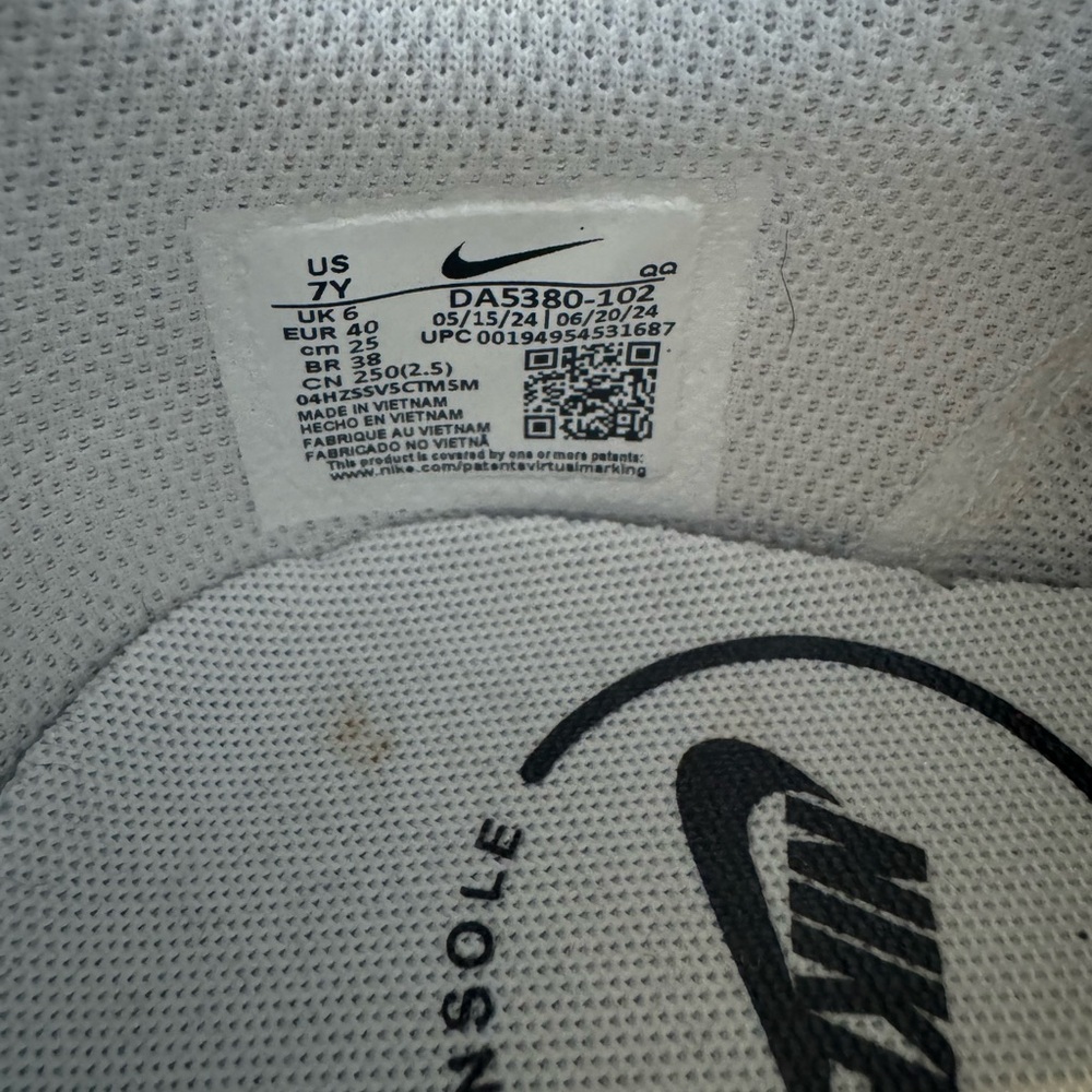 Nike White Low-Top Sneakers with Black Swoosh and Gold Accent - Picture 6 of 6